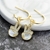 Picture of Copper or Brass Gold Plated Dangle Earrings in Exclusive Design