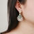 Picture of Designer Gold Plated Casual Dangle Earrings with Easy Return